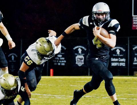 Cuttler Adams (4) leaves Hayesville’s Cameron Payne laying during Friday’s regular-season finale against Hayesville. Through eight games of his sophomore campaign, Adams has amassed 1,253 rushing yards and has found the end zone on 14 different occasions. Photos by Art Miller/amiller@grahamstar.com
