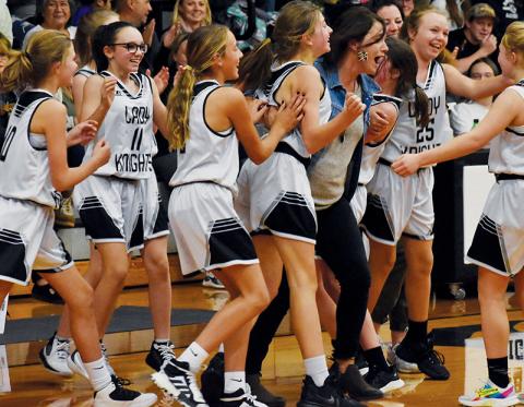 Members of the Robbinsville Middle School Lady Knights erupt with jubilation, moments after picking up a victory over Andrews in the closing seconds of their Nov. 4 home game. Photos by Kevin Hensley/sports@grahamstar.com