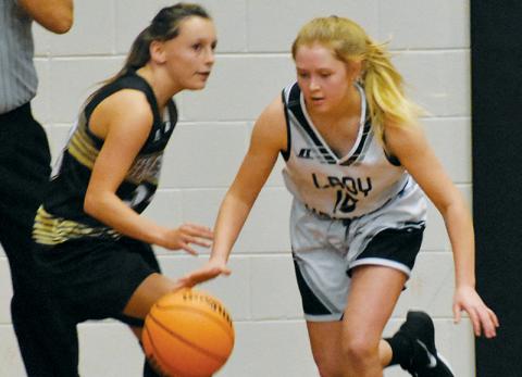 Middle school Lady Knight Novie Dutcher (15) breaks away from the Hayesville defense during Monday’s game. Photos by Kevin Hensley/sports@grahamstar.com