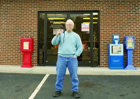 Graham Star staff photographer Art Miller with his first camera, given to him by his parents in 1960. Miller will step down as the Star’s staff photographer at the end of the year. Photo by Charlie Benton/news@grahamstar.com