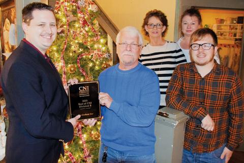 Graham Star personnel show off their “Best of CNI, Division B” award for 2020. Front row (from left) are Kevin Hensley, publisher/editor; Art Miller, staff photographer; and Charlie Benton, staff writer. Standing in back are Diane West, office manager (left) and Debbie Dills, advertising. Photo by Randy Foster/The Graham Star