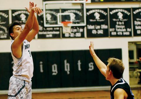 Robbinsville’s Xander Wachacha launches one of his three, late buckets from outside the arc Friday against Smoky Mountain. Photo by Miranda Buchanan/Robbinsville High School Yearbook