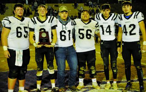 An emotional group of Black Knights accept the N.C. High School Athletic Association’s 1A Western Regional runner-up plaque Friday night at Mitchell High School. From left are Carson White, Isaac Wiggins, Drake Hill, Carlos Wesley, Dasan Gross and Eddie Brooms. Photo by Zack Colburn/ZWCSports