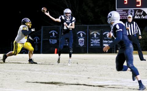 Dasan Gross fires a rocket to Cuttler Adams during Friday’s fourth-round playoff game against Murphy. In Gross’ strongest showing to date, the senior quarterback finished the game 9-of-11, with 136 passing yards and seven, third-down conversion completions. Photos by Miranda Buchanan/Robbinsville High School Yearbook