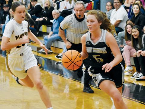Lady Knights senior Halee Anderson makes a hard cut past the defense of Murphy’s Lailee Holloway during Tuesday’s road game. Photos by Kevin Hensley/sports@grahamstar.com