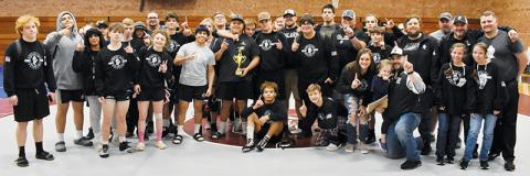 Members of the Robbinsville wrestling program pose with the 2021 Devil Duals trophy, after the Knights conquered the field Dec. 22. Photos by Kevin Hensley/sports@grahamstar.com