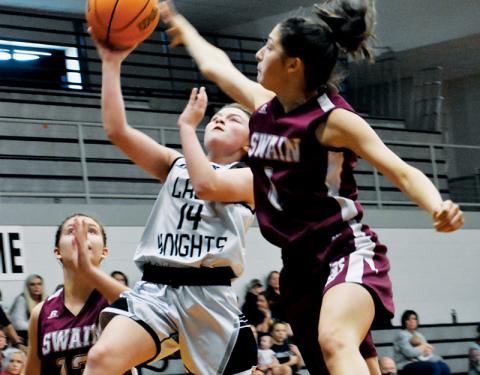 Chloe Adams (14) looks to outpace the Swain County defense during the second half of Dec. 16’s game. Photos by Kevin Hensley/sports@grahamstar.com