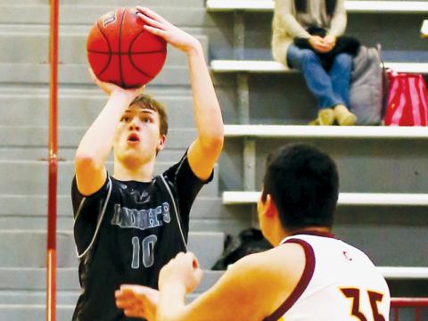 Black Knights freshman Bryce Adams lines up a corner shot Jan. 13 at Cherokee. Photo by Miranda Buchanan/Robbinsville High School Yearbook