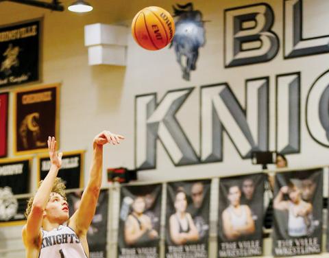 Senior Kamdyn Jordan puts up a floater during Dec. 30’s home victory over Tellico Plains, Tenn. Photo by Miranda Buchanan/Robbinsville High School Yearbook