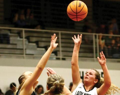 Desta Trammell airs out an inside shot Friday against Robbinsville. The junior point guard put up 25 against the Lady Jackets, surpassing the 900-point career threshold in the Lady Knights’ 64-38 win. Photo by Miranda Buchanan/Robbinsville High School Yearbook