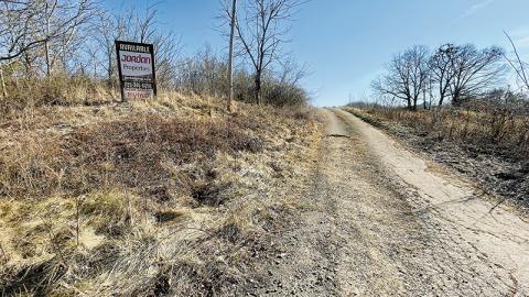 An “available” sign is still in place on a 32-acre parcel sold to the Eastern Band of Cherokee Indians by Randy Jordan and Warren Dudley Orr. The property is located between U.S. Highway 129 and Old U.S. Highway 129, with riverfront access on the Cheoah River. Photos by Randy Foster/news@grahamstar.com