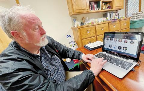 Eric Reece, pastor at Robbinsville United Methodist Church, watches as honorees are named by the Institute for Emerging Issues as “making North Carolina a better place” on Feb. 22. Photo by Randy Foster/news@grahamstar.com