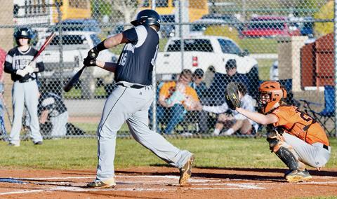 Robbinsville freshman Dayne Webster puts a charge into a pitch during March 10’s home opener against Rosman. Webster’s connection resulted in a solo home run. Photo by Raven Rattler/Robbinsville High School Yearbook