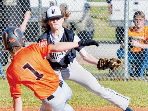 Kade Garrison waits to apply the tag to Rosman’s Aaron Eubanks during March 10’s home game. Photo courtesy of Raven Rattler/Robbinsville High School Yearbook