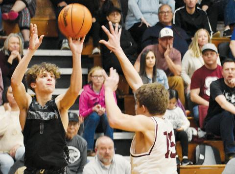 Robbinsville’s Kamdyn Jordan puts up a corner 3-pointer during the Feb. 15 Smoky Mountain Conference Tournament semifinals against Swain County. Photo by Kevin Hensley/sports@grahamstar.com