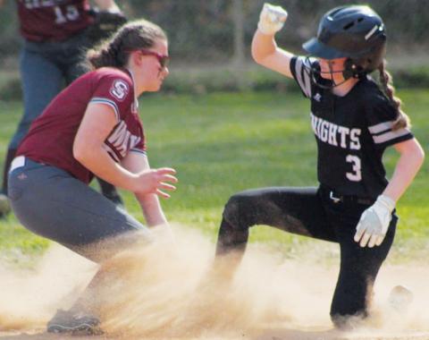 In a cloud of dust, middle school Lady Knight Daphne Barlow slides under the tag during Tuesday’s road loss to Swain County. Photo courtesy of Tyffany Hicks/Contributing Photographer