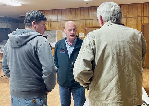 Rod Honeycutt speaks to Graham County Armed Patriots members Adam Phillips (left) and Kevin Haag during a March 1 stop in Robbinsville. Photo by Randy Foster/news@grahamstar.com
