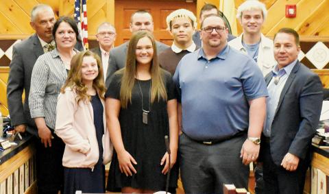 xFlanked by members of the tribal council – as well as his family – Todd Odom (center, second from right on front row) was  inducted as an honorary member of the Eastern Band of Cherokee Indians on April 7. Photos by Kevin Hensley/editor@grahamstar.com