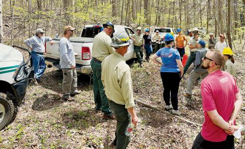 A range of people including representatives from the logging industry, environmental groups, and local government listen to U.S. Forest Service officials describe the Crossover Project near the Graham-Cherokee county line on April 22. Photos by Randy Foster/news@grahamstar.com