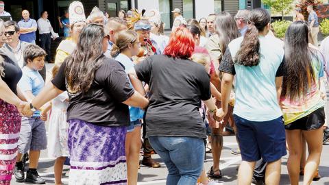 Bo Taylor (center) leads a friendship dance following the ribbon cutting at the Jacob Cornsilk Community Center in the Snowbird community on Friday. Photos by Randy Foster/news@grahamstar.com