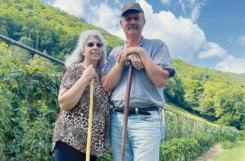 Brenda and Harold Williams pose beside their Beech Creek garden July 18. Photos by Randy Foster/news@grahamstar.com