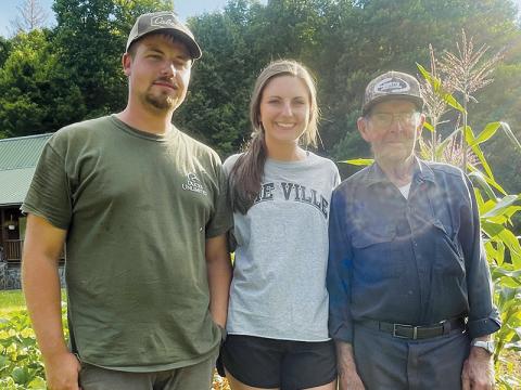 Cameron and Hannah Anderson (left) stand with Hannah’s grandfather Billy Holder, who is helping them with their garden off Lower Stecoah Road. Photos by Randy Foster/news@grahamstar.com