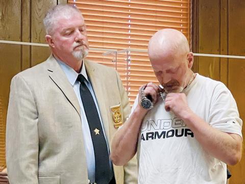 Graham County Jail Adminstrator Marlon Jackson (left) looks on as Bryan Aaron Berryman turns in his necklace and watch in Graham County Superior Court on July 13. Berryman had just been sentenced to between 11-15 ½ years in prison for a litany of charges obtained in an April 2021 arrest. Photo by Randy Foster/news@grahamstar.com