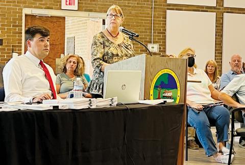 Town of Lake Santeetlah council member Diana Simon answers questions from attorney John Noor at the July 7 preliminary voter challenge hearing with the Graham County Board of Elections. Seated in the gallery between Noor and Simon is council member Tina Emerson, who is one of eight in Lake Santeetlah being challenged. Photo by Kevin Hensley/editor@grahamstar.com
