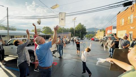 In a fitting tribute to late Black Knights megafan Billy Ed Queen, spectators attending Friday’s  kickoff to the two-day 150th anniversary celebration in Robbinsville were given white towels to toss into the air – a move patented by Queen whenever Robbinsville would score a touchdown. Photos by Randy Foster/news@grahamstar.com
