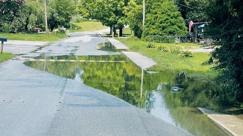 The Town of Robbinsville is looking to apply for a grant to pay for a stormwater management master plan, which can be used to guide infrastructure improvements to avoid localized flooding – such as this situation on Ford Street following heavy rains two weeks ago. Photo by Randy Foster/news@grahamstar.com