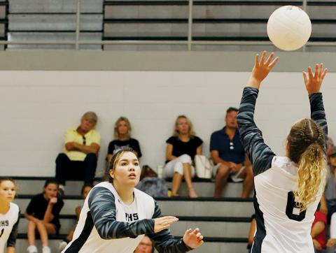 Aubrie Wachacha (left) breaks to hammer the set from Desta Trammell during Tuesday’s home match against Highlands. Photo courtesy of Miranda Buchanan/Robbinsville High School Yearbook