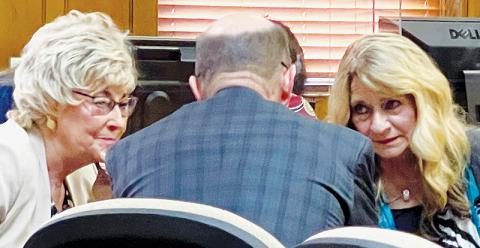 Connie Orr, chairman of the Graham County Board of Commissioners, lawyer Dale Curriden and Juanita Colvard, who helped develop the county’s plan for urgent care and imaging services (from left) confer in court Monday, while waiting on a judge’s ruling in a lawsuit filed by Smoky Mountain Urgent Care. Photos by Randy Foster/news@grahamstar.com