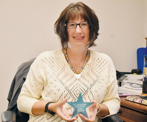 Graham County Health Director Beth Booth displays her Ron Levine Public Health Award, which was given to all directors in North Carolina. Photo by Kevin Hensley/editor@grahamstar.com