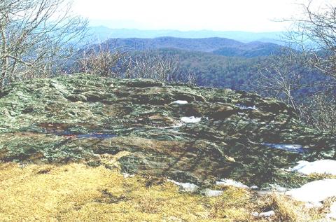 This large rock on Hooper Bald is inscribed with writing dating to 1615. Photo by Marshall McClung/The Graham Star