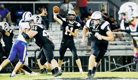 With Haden Key (66) holding off a Brevard defender – and both Cuttler Adams (4) and Brock Adams (2) breaking upfield, quarterback Donovan Carpenter aims a pass as part of Friday’s home opener against the Blue Devils. Robbinsville picked up its first win of the season in the rematch from last year’s loss. Photos courtesy of Miranda Buchanan/Robbinsville High School Yearbook