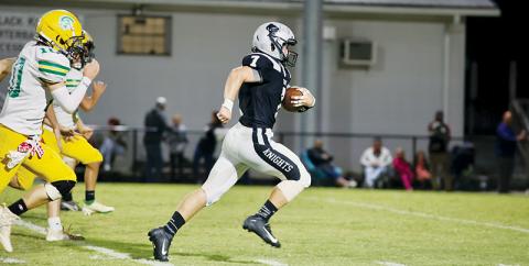 Not a Trojan was found in the path of senior fullback Turner Jackson on Friday, as he began a 58-yard scoring sprint during the Knights’ 40-7 squashing of Alleghany. Photo by Miranda Buchanan/Robbinsville High School Yearbook