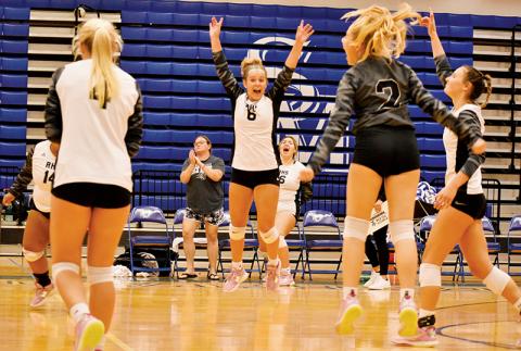 Robbinsville senior Desta Trammell (6) could not contain her excitement after the final point of the Lady Knights’ 4-set victory at Smoky Mountain on Monday. Also soaking up the moment was Tai Owle (14), Kensley Phillips (4), assistant coach Dede Brooms, Aubrie Wachacha (16), Suri Watty (2) and Delaney Brooms. Photos by Kevin Hensley/sports@grahamstar.com