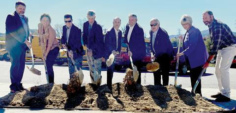 Dignitaries participate in a ceremonial groundbreaking for the Corridor K highway project in Graham County at Robbinsville High School on Monday. From left are Ronnie Keeter, Wanda Austin, Brian Burch, John Sullivan, Eric Boyette, Chris Peoples, Dirk Cody, Connie Orr and Jacob Nelms. Photo by Randy Foster/news@grahamstar.com
