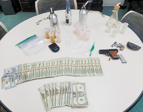 In what is being touted as the biggest drug bust in Graham County’s history, officers seized 900 grams of liquid methamphetamine during a raid late-Friday. Also recovered was a plethora of cash, drug paraphernalia and firearms. Photo courtesy of Graham County Sheriff's Office