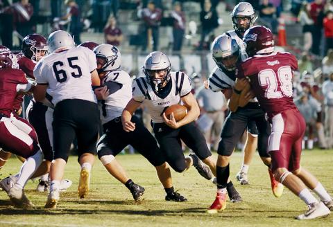 Cuttler Adams slices through a jostle at the line during the Sept. 29 conference opener at Swain County. Adams was responsible for all of Robbinsville’s scoring in the Knights’ win over the Maroon Devils. Photo by Miranda Buchanan/Robbinsville High School Yearbook