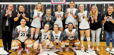 The Robbinsville Lady Knights clinched a share of the Smoky Mountain Conference title for the second time in four seasons Oct. 13, sweeping Swain County on senior night. All names are listed from left. Front row: Fala Welch, Claire Barlow, Desta Trammell and Tai Owle. Back row: Assistant coach Dede Brooms, manager Eden Orr, Liz Carpenter, Suri Watty, Delaney Brooms, Aubrie Wachacha, Kensley Phillips, head coach Kadey Phillips and line judge Jade Teesateskie. Photo by Kevin Hensley/sports@grahamstar.com