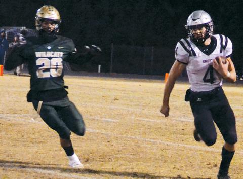 Cuttler Adams (4) dashes around the pursuit of Eastern Randolph’s Pierce Leonard on a second-half run Friday. Adams eclipsed 200 rushing yards in the game, but Robbinsville fell 29-26 to the Wildcats in the third round of the state playoffs. Photos by Kevin Hensley/sports@grahamstar.com