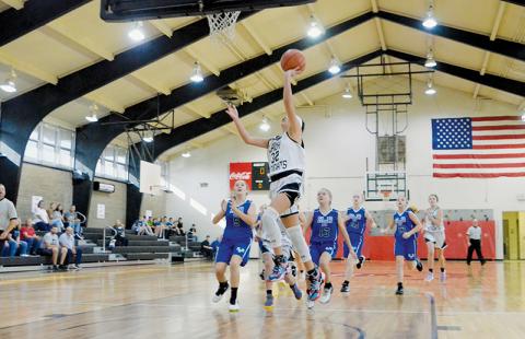 Zayleigh Chekeleelee outpaces the pursuit of Hiwassee Dam/Ranger defenders for a lay-up during the Nov. 3 season opener. Chekeleelee led the Lady Knights with a 10-point afternoon. Photos by Kevin Hensley/sports@grahamstar.com