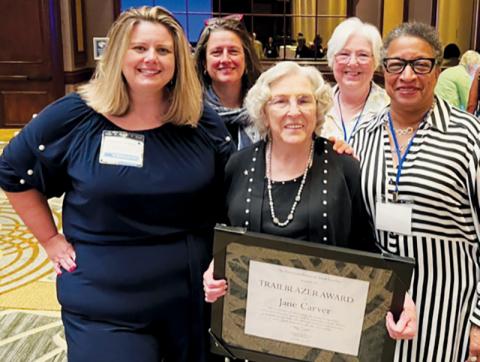 Tri-County Democratic Women member Jane Carver (front, center) had plenty of support when she received the distinguished Trailblazer Award in Greensboro. Front row: Elizabeth Goodwin, Democratic Women of North Carolina President; Carver; and Tri-County Democratic Women President Pat Sherrill. Standing in back are Julia Buckner, a past president of the Democratic Women of North Carolina; and Diane Snyder, Tri-County Democratic Women member.
