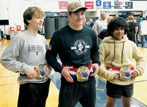 Loxston Hooper, Kage Williams and Adair Panama (from left) sport the championship belts they received for conquering their respective weight classes at the Nov. 23 Jet Invitational. Photo by Kevin Hensley/sports@grahamstar.com