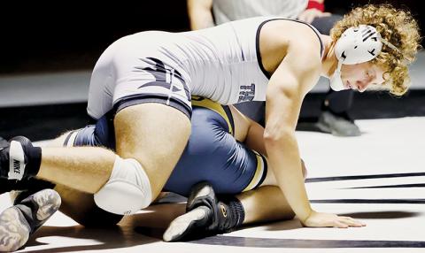 Robbinsville senior Turner Jackson dictates his Dec. 20 home bout against Hayesville’s Seth McCaslin. Jackson went on to best McCaslin in a 15-2 majority decision. Photo courtesy of Miranda Buchanan/Robbinsville High School Yearbook