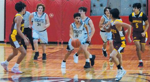 Robbinsville Middle School’s Xamuel Wachacha weaves through heavy transition traffic Dec. 5 against Cherokee. Photo by Kevin Hensley/sports@grahamstar.com