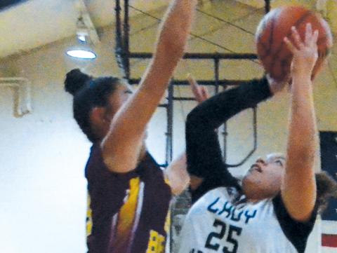 Zirriyah Wachacha drives to the basket Dec. 5 against Cherokee. Photo by Kevin Hensley/sports@grahamstar.com