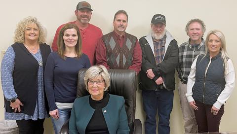 Graham County acting manager Kim Crisp, commissioners Natasha Williams, Jacob Nelms, Connie Orr (seated), Lynn Cody and Keith Eller (from left) appear with Dr. David Booth and his wife Cora Booth (right), following contract negotiations Monday. Photos by Randy Foster/news@grahamstar.com