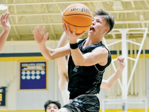Brock Adams takes flight Monday at Highlands. Robbinsville’s senior point guard was one of three Black Knights to reach double digits in the victory. Photo by Kevin Hensley/sports@grahamstar.com